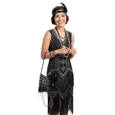 Femme souriante en déguisement des années 20 tenant un sac à main noir à franges et sequins | jourdefete.com Femme souriante en déguisement des années 20 tenant un sac à main noir à franges et sequins | jourdefete.com